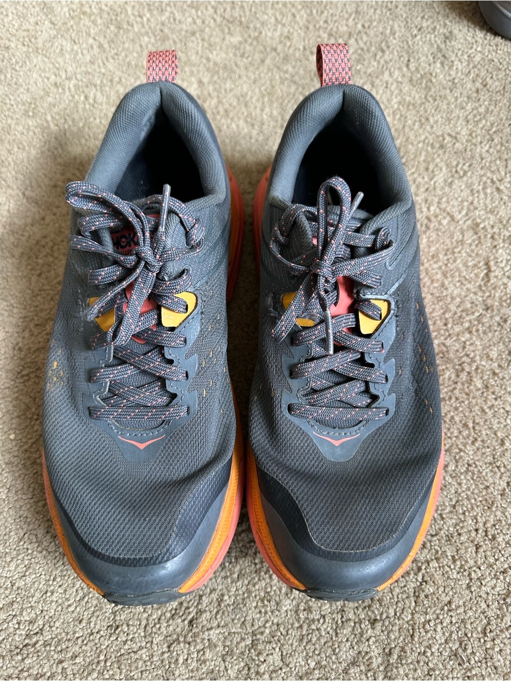 Hoka women’s Gray and Orange Trail Running Shoes